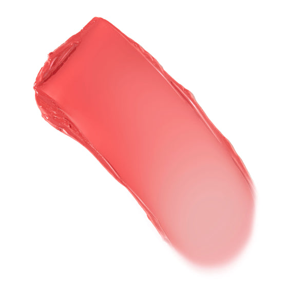 Creamy Baby Bunny Lip and Cheek Balm swatch glides diagonally across a white background, showing a warm coral-pink tint with a dewy, buildable finish - ColourPop Lip and Cheek Balm shade Baby Bunny for lips and cheeks.