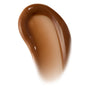 Curved swipe of Chocolate Milkshake ColourPop Lip Mask, a creamy, high-shine caramel-brown swatch on a white background, showcasing the thick glossy texture and tinted finish for accurate shade and texture reference.