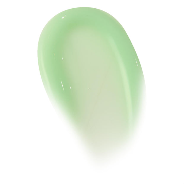Glossy smear of Pistachio Gelato ColourPop Lip Mask, a pastel pistachio-green balm swatch showing creamy, semi-sheer texture and high shine on a white background.