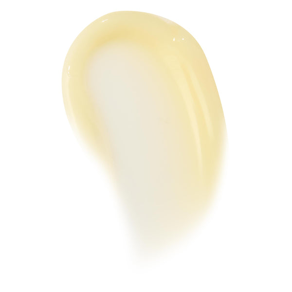 Glossy pale-vanilla swipe of Vanilla Cake lip mask, showing thick balm texture and translucent sheen on a clean white background; ColourPop Lip Mask swatch highlighting creamy, hydrating finish for overnight lip care.