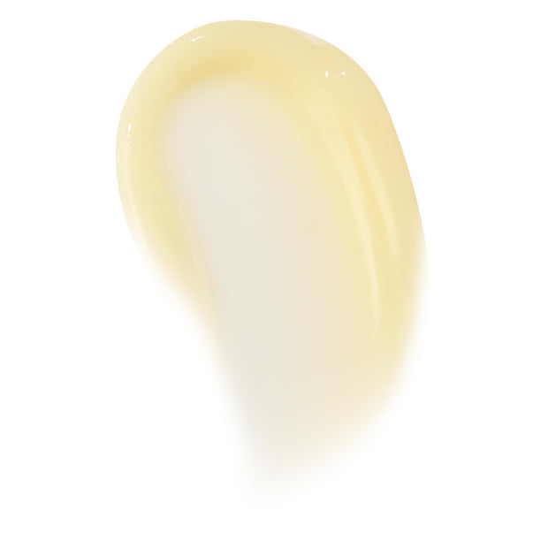 Glossy pale-vanilla swipe of Vanilla Cake lip mask, showing thick balm texture and translucent sheen on a clean white background; ColourPop Lip Mask swatch highlighting creamy, hydrating finish for overnight lip care.