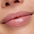 Glossy, hydrated lips wearing You’re a Catch ColourPop Lip Mask, showing a sheer pink tint with fine shimmer and a high-shine, plumped finish in a tight close-up beauty shot.