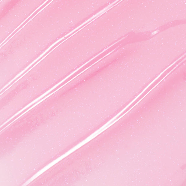 You're a Catch ColourPop Lip Mask swatch gliding in diagonal streaks, showing a sheer baby pink, glossy, micro-shimmer finish in a close-up texture shot.