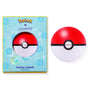 Poké Ball–shaped You're a Catch ColourPop Lip Mask shown beside its blue Pokémon x ColourPop box, labeled Berry Lip Mask 6.5 g (0.23 oz); red-and-white sphere jar with black center band on a white background.