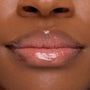 Lips wearing ColourPop Lip Mask in Strawberry Milk, gleaming with a sheer pink, high-shine finish in a tight close-up that emphasizes smooth, hydrated texture.