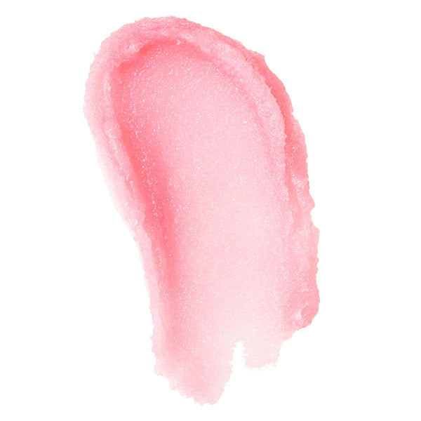 Shimmery pink sugar lip scrub swatched in a thick oval smear on a white background, highlighting fine exfoliating crystals and a balm-like sheen; ColourPop lip care swatch for gentle lip exfoliation and smoothing.