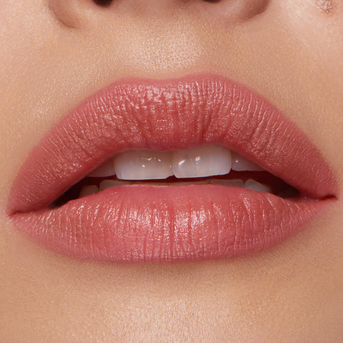 Full lips wearing ColourPop Lippie Pencil in Five Stars, lining and filling with a warm rosy nude shade and soft satin finish, shown in a tight close-up to highlight crisp edges and even color payoff.