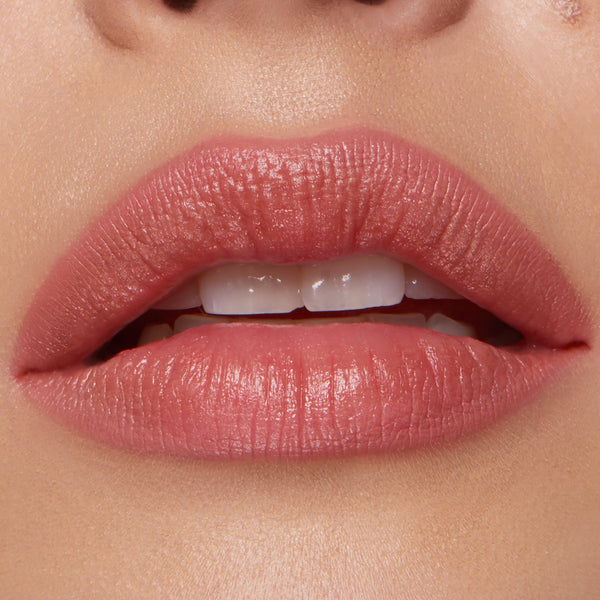 Full lips wearing ColourPop Lippie Pencil in Five Stars, lining and filling with a warm rosy nude shade and soft satin finish, shown in a tight close-up to highlight crisp edges and even color payoff.