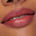 ColourPop Lippie Pencil in Me Again lining and filling lips, creating a precise rosy‑mauve satin finish; close-up of a model’s slightly parted mouth shows smooth texture and clean edges for an everyday nude lip look.