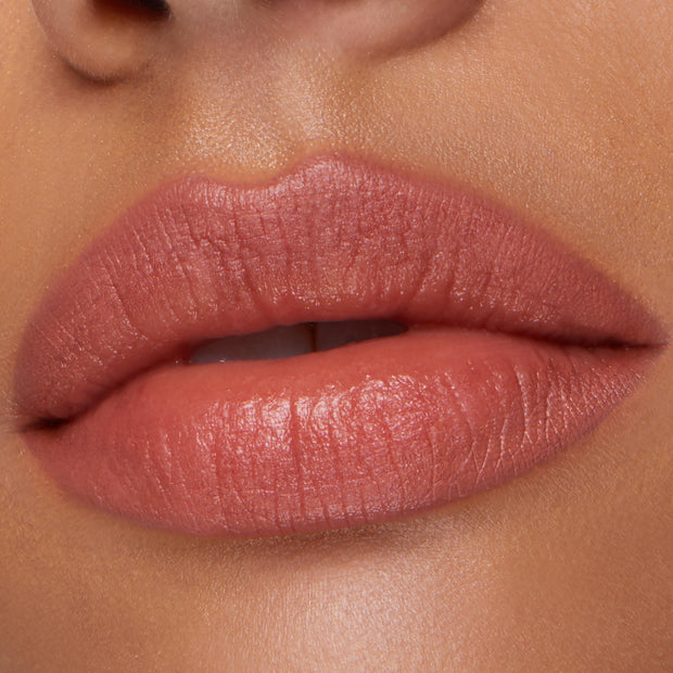 Lips lined and filled with Five Stars ColourPop Lippie Pencil lip liner, a warm pink‑nude shade, showing smooth satin payoff in a close-up beauty swatch of the mouth area.