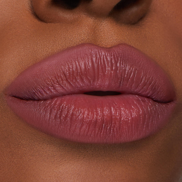 Full lips wearing ColourPop Lippie Pencil in Me Again, a rosy-mauve lip liner defining and softly filling the lips with smooth, precise edges in an extreme close-up beauty swatch on natural skin background.