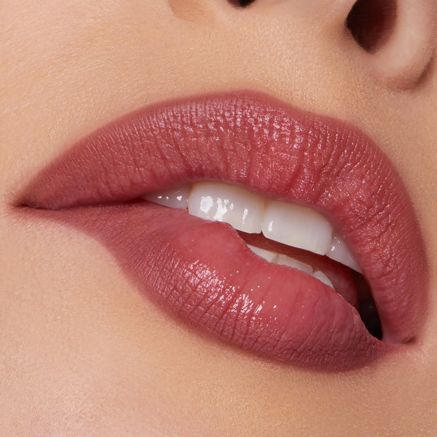 Rosy mauve lips wearing Me Again, a ColourPop Lippie Pencil, lining and filling with a creamy satin finish; close-up highlights precise edges, smooth texture, and rich color payoff against warm skin.