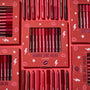 ColourPop Bring The Heat Lippie Pencil set arranged in a flat lay, showcasing creamy lip liners in reds, pinks, and berry tones; boxed and loose pencils surround the main kit on a red background with lips, stars, and lightning graphics.
