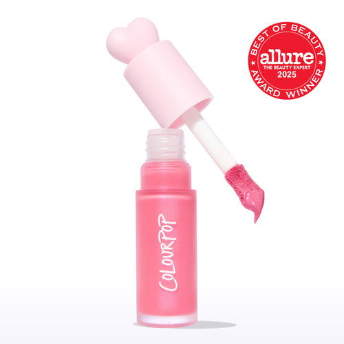 ColourPop Liquid Blush Princess Ave displays a frosted pink tube with COLOURPOP logo as the doe-foot applicator lifts a creamy rosy-pink swipe, topped by a heart-shaped cap, with a 2025 Allure Best of Beauty award badge on a white backdrop.