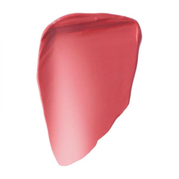 She’s Cute ColourPop Liquid Blush swatch spreading in a smooth, glossy smear, revealing a warm peachy-pink shade with dewy, buildable coverage on a clean white background.