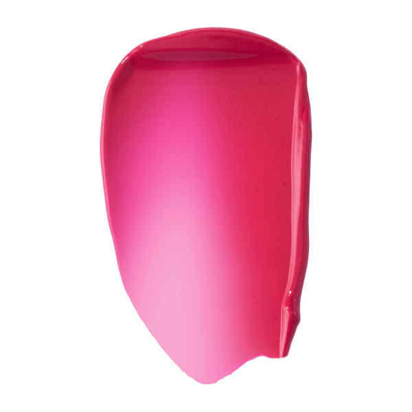 Hot pink fuchsia swatch of ColourPop Liquid Blush, shade Wildest Dreams, smeared in a glossy, high-pigment swipe that fades from sheer light pink center to deeper rosy edges on a clean white background.