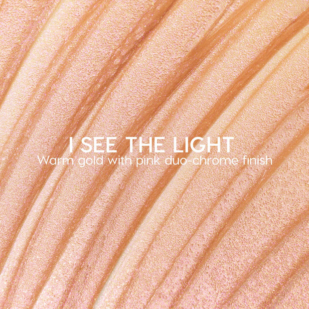 I See the Light ColourPop Liquid Highlighter swatched in sweeping ridges, showing a warm gold base with pink duochrome shimmer; creamy liquid texture gleams under light in a close-up macro for a luminous glow.