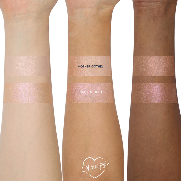 I See the Light, a ColourPop Liquid Highlighter, swatched as a luminous pink‑pearl shimmer on three skin tones, shown beneath the peachy champagne Mother Gothel shade on forearms to compare finish, glow, and sparkle.