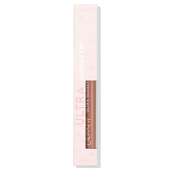 Lynx ColourPop Ultra Glossy Lip displayed upright in a pale pink box with star accents, a clear window revealing a nude‑beige gloss tube labeled “Ultra Glossy,” set against a clean white background.