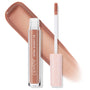 ColourPop Ultra Glossy Lip in Lynx shown with doe-foot wand and pink star-print cap beside a clear tube, with a glossy warm nude caramel swatch behind it, highlighting the high-shine finish in a studio product shot on white.