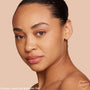 Model showcasing ColourPop Pretty Fresh Tinted Moisturizer, shade Medium 9W, wearing a natural, dewy finish with even coverage; close-up three-quarter face against a nude background, highlighting warm undertone and skin-like glow.