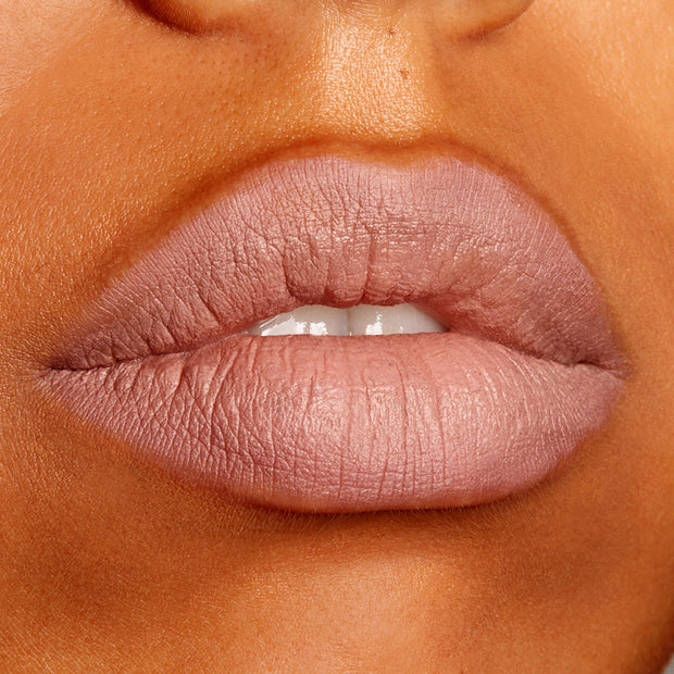 Lips wearing ColourPop Lippie Pencil Cool BFF, outlining and filling a cool nude mauve shade with a soft matte finish, shown in an extreme close-up beauty swatch for precise lip definition.