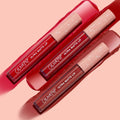 Major Hottie Ultra Matte Lip bundle showcasing three ColourPop Ultra Matte Lip tubes in rich red shades, arranged diagonally atop glossy swatches; blush-pink star caps and white logos on a soft pink backdrop.