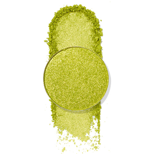 Mary Jane ColourPop Pressed Powder Shadow pan showcases a bright lime-green metallic shade with gold shimmer, shown crushed and swatched with loose pigment around the round pan on a white background to highlight sparkle and payoff.