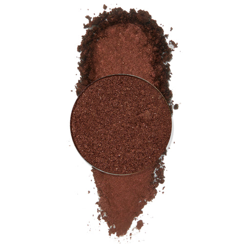 Material Girl ColourPop Pressed Powder Shadow pan spills crushed metallic deep copper-brown shimmer into a soft swatch, with the round refill centered on a clean white background.