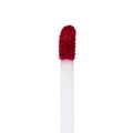 Doe-foot applicator coated in Melonade, a bold watermelon-red Ultra Matte Lip, showing velvety pigment and texture, standing upright against a clean white background - ColourPop Ultra Matte Lip product macro for precise color detail.