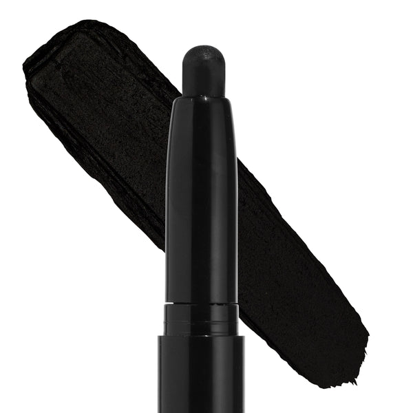 Midnight Hour ColourPop Shadow Stix delivering intense black pigment, shown uncapped with a rounded tip beside a thick swipe swatch on a white background, a creamy eyeshadow stick for bold smoky‑eye looks.