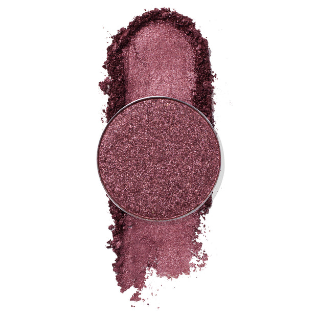Miss U ColourPop Pressed Powder Shadow, a shimmery mauve‑plum single, shown in a round pan with crushed pigment and a bold swipe swatch, highlighting metallic sparkle and rich payoff on a white background.