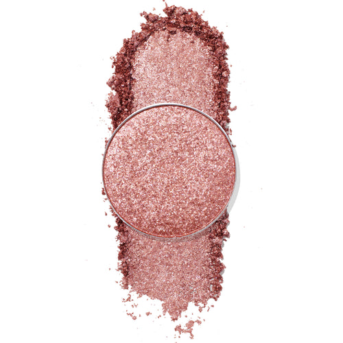 ColourPop Misty Pressed Powder Shadow pan, a shimmery rose-gold shade, shown crushed and swatched in a vertical streak, metallic glitter catching light, single refill pan on a clean white background.