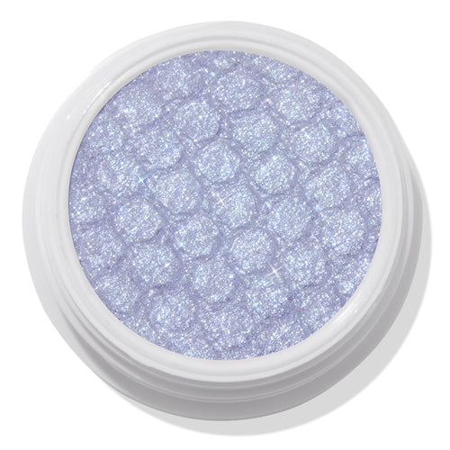 ColourPop Moon Daisy Super Shock Shadow shimmering in an open white pot; an icy lavender-lilac eyeshadow with silver microglitter and a dimpled, bouncy texture, shown close-up on a clean white background.