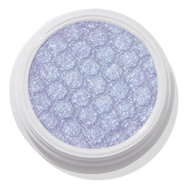 ColourPop Moon Daisy Super Shock Shadow shimmering in an open white pot; an icy lavender-lilac eyeshadow with silver microglitter and a dimpled, bouncy texture, shown close-up on a clean white background.