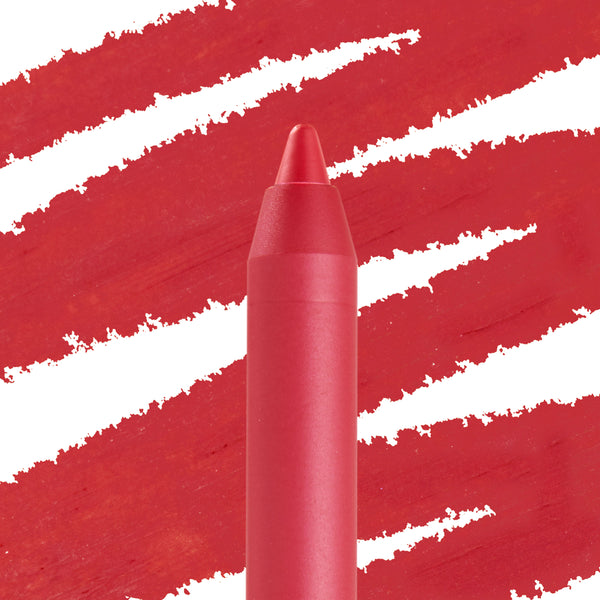 Overtime ColourPop Lippie Pencil tip displaying smooth, vivid red pigment, positioned upright in a macro close-up against bold diagonal red swatch strokes on white, emphasizing its precise point for lip lining.