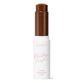 ColourPop Pretty Fresh Tinted Foundation Balm in Deep Dark 22, a twist-up foundation balm stick, stands open with a rich deep-brown bullet, housed in a white tube with peach 'Pretty Fresh' lettering, shown upright on a clean white background.