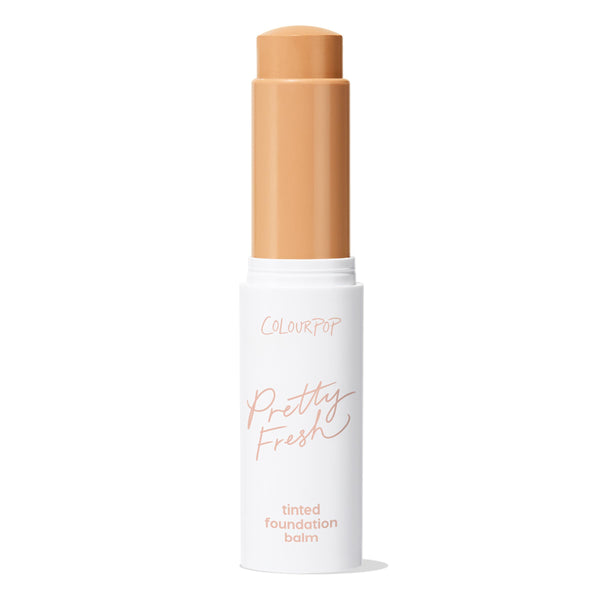 ColourPop Pretty Fresh Tinted Foundation Balm, shade Medium 12, twists up from a white tube with peach lettering, the medium beige stick extended against a clean white background for swipe-on, buildable coverage.