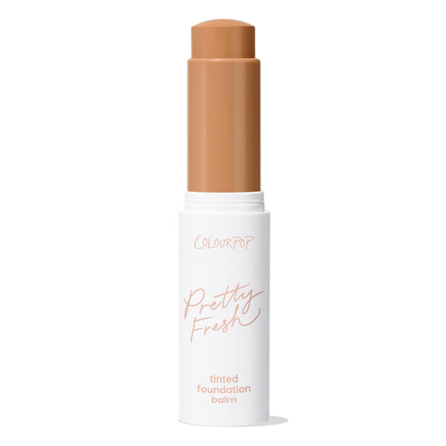 ColourPop Pretty Fresh Tinted Foundation Balm in Medium Dark 16, stick bullet extended from a white tube with rose-gold lettering, standing upright with cap off against a clean white background.
