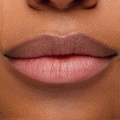 Close-up lips changing from natural to a soft pink after applying Transform pH Lip Balm, showing the color-adapting, glossy finish of ColourPop pH Lip Balm in studio lighting.