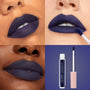 Panther Ultra Matte Lip liquid lipstick coating lips in a deep navy‑purple, applied with a doe‑foot and shown on multiple skin tones, with the ColourPop Ultra Matte Lip tube and applicator displayed against a purple background.