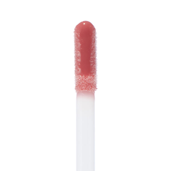 Doe-foot applicator coated in Pasadena Ultra Glossy Lip glistens with high-shine rosy mauve color, showcasing the plush flocking and wet finish in a crisp macro on a white background; ColourPop Ultra Glossy Lip.