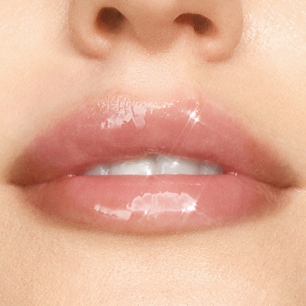Glossy pink lips wearing ColourPop Dream Duo Ultra Lip Duo, showing a high-shine, sheer tint and hydrated finish in a tight close-up of the mouth and nose on natural skin.