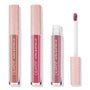 Perfect 4 U ColourPop Ultra Glossy Lip trio stands upright with one tube opened, a doe-foot applicator showing rosy mauve; clear barrels and blush-pink caps with white stars display nude, pink, and mauve shades on a white studio background.