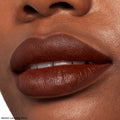 Lips wearing deep chocolate-brown matte lipstick, showcasing the 'Pitch' shade from The Lil Box of Lippie Stix, a ColourPop Lippie Stix set, in a tight beauty close-up highlighting smooth, full-coverage color payoff.