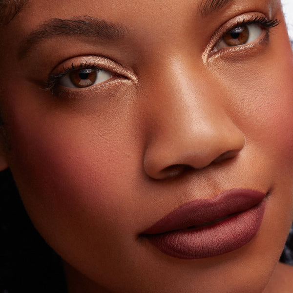 Berry-brown lips lined and filled with Hoopty ColourPop Lippie Pencil, a matte lip liner, showing crisp edges and smooth color; close-up beauty shot with warm blush and gold shimmer eyelids for an everyday glam look.