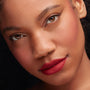 Bossy ColourPop Lippie Pencil lining and filling lips in a deep blue‑red matte, creating crisp, velvety edges; close-up beauty portrait with soft shimmer eyeshadow and natural complexion, highlighting precise lip liner results.