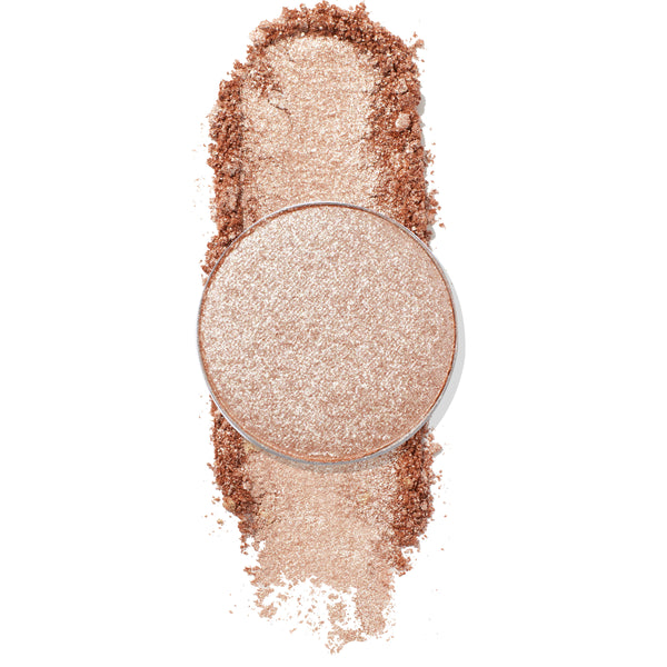 Round pan of ColourPop Ringer Pressed Powder Shadow gleams in a shimmery champagne rose‑gold, shown pressed with soft crumble and a vertical swatch to reveal metallic payoff on a clean white background.