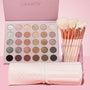 Major Eye Candy ColourPop Shadow Palette & Brush Set opens to 30 neutral and rose-toned mattes, shimmers, and glitters, paired with cream brushes in a clear acrylic holder with rose-gold ferrules and a pink brush roll on a pastel pink background.