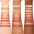 Rock On ColourPop Shadow Palette swatches sweep across three arms in light, medium, and deep skin tones, showing nine warm neutrals - champagne to copper and brick red - with matte and metallic finishes; shades include Vortex, Sedona, Red Rocks, Trail Mix.